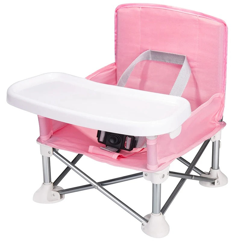 Rehausseur pliant et transportable. Une chaise pliable idéale pour les repas de bébé. Très pratique pour l'intérieur, l'extérieur et les voyages. Couleur rose
