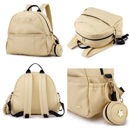 Le sec à langer BlackDiaperBackPack  ouvert avec tout le nécessaire de bébé bien rangé de couleur beige