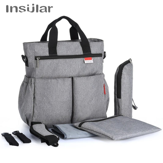 Sac Mama Bag porté en sac à dos ou bandouliÚre selon les besoins