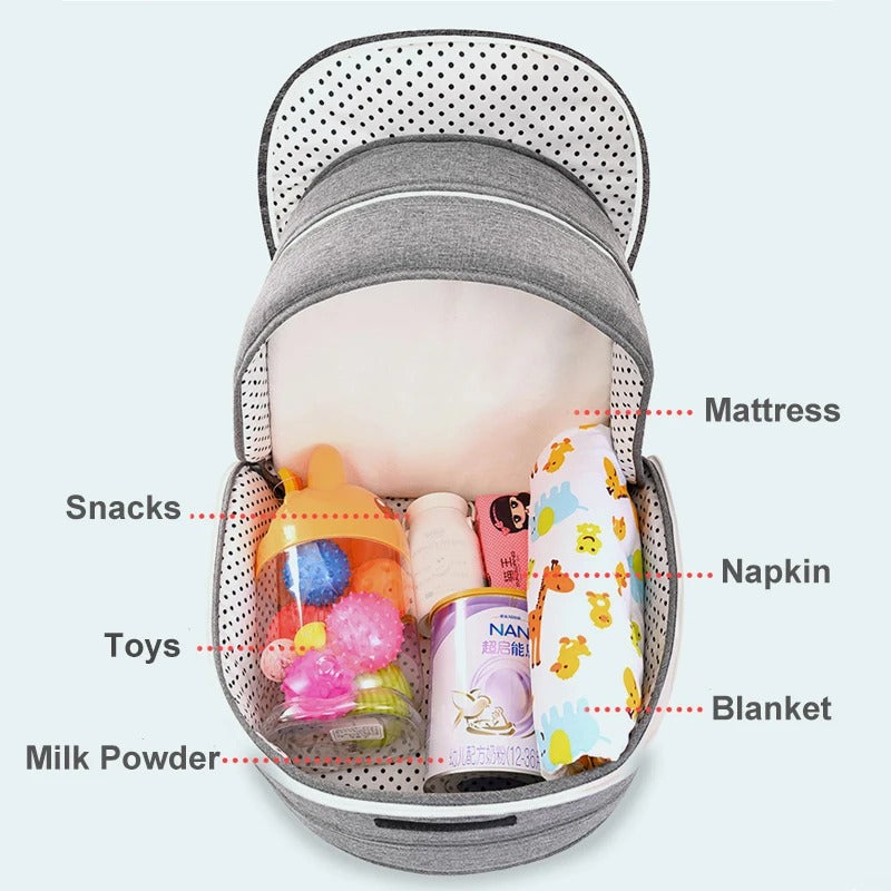 Démonstration de pliage facile d'un berceau de voyage bébé avec son compartiment de rangement
