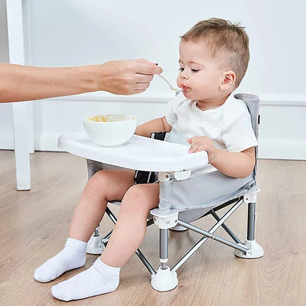 Rehausseur pliant et transportable. Une chaise pliable idéale pour les repas de bébé. Très pratique pour l'intérieur, l'extérieur et les voyages