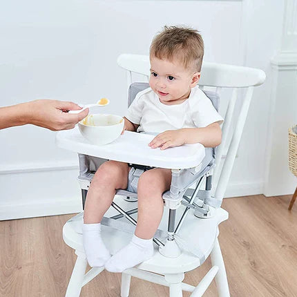 Rehausseur pliant et transportable. Une chaise pliable idéale pour les repas de bébé. Très pratique pour l'intérieur, l'extérieur et les voyages. Également utilisable sur une chaise.