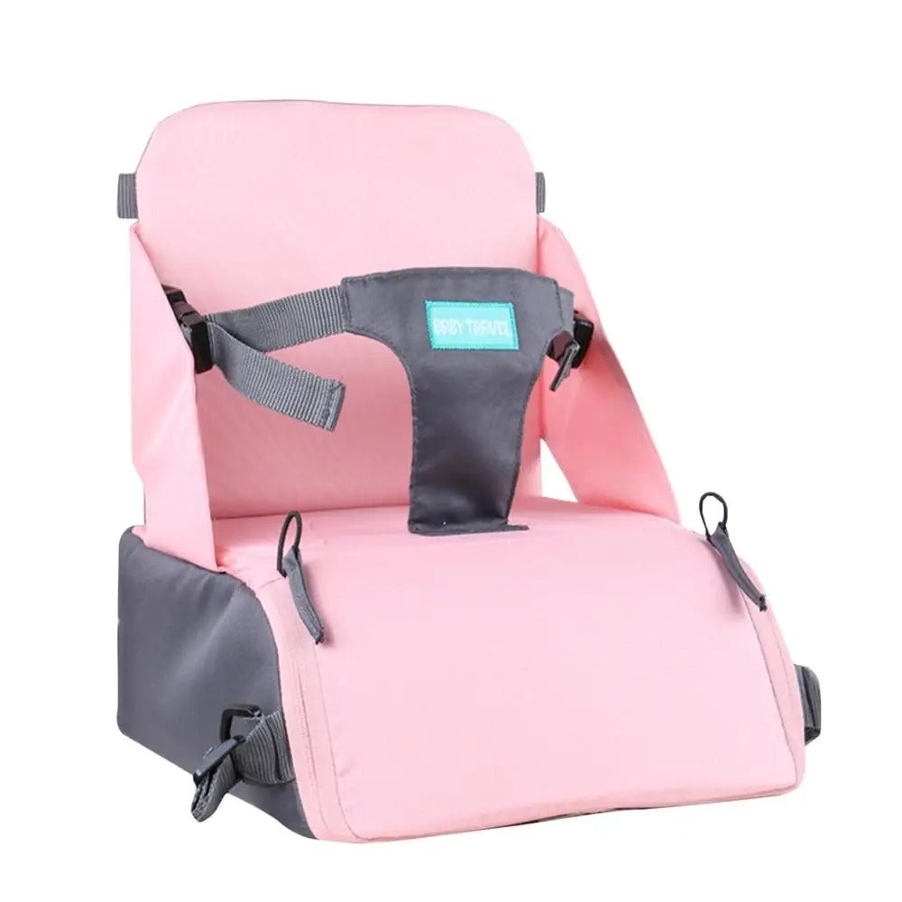 Siège de table mais aussi rehausseur de chaise pour bébé super pratique pour vos déplacements de couleur rose